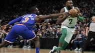 Tim Hardaway Jr. trying to poke the ball away from Jaylen Brown.